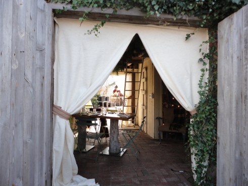 This shed has curtains. How charming in an Anthropologie kind of way.
