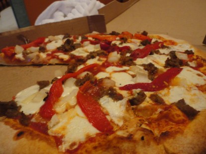 The pizza in question with house made mozzarella, sausage, roasted red peppers and onions