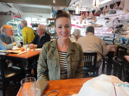 I'm smiling because there's half a pizza, six macaroons, and eight chocolate cream cheese cookies in my to go bag