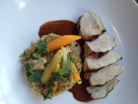 Pork with quinoa, baby carrots, roasted artichokes and garlic jus