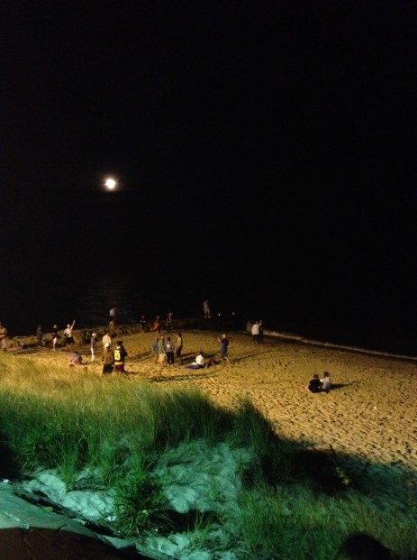 The moon shone bright over the water